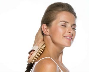 woman relieving shoulder pain